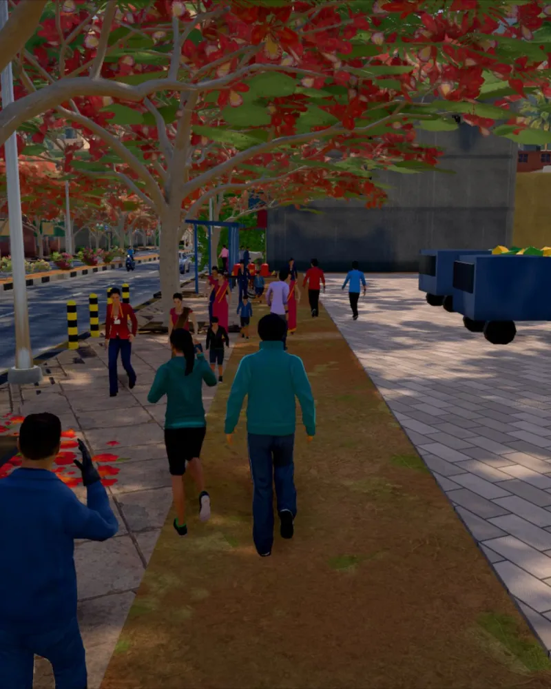 A busy footpath under the gulmohars, people walking to the market.